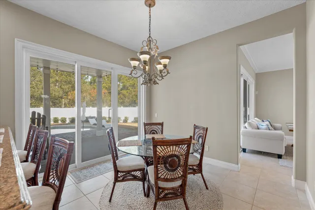 a bed sitting in a bedroom and a flat screen tv