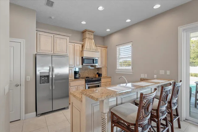 a view of a livingroom with furniture a ceiling fan and wooden floor