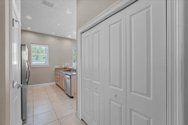 a bath tub sitting in a bathroom next to a window