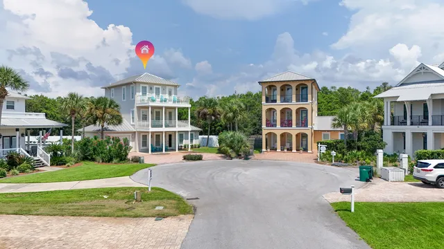 a view of a bedroom with furniture and a window