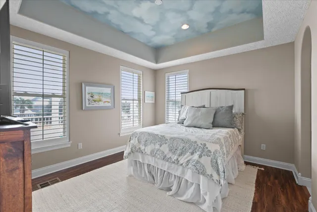 an aerial view of a house with a yard and pool