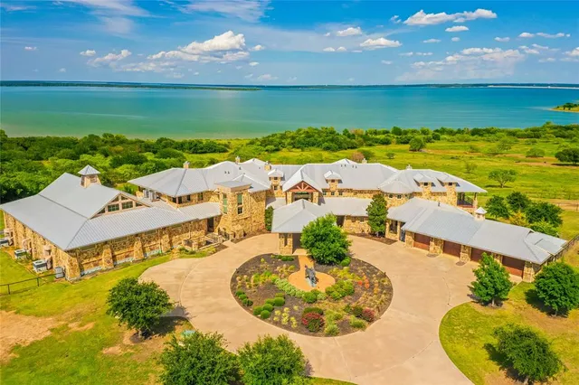 a view of a terrace with yard and mountain view in back