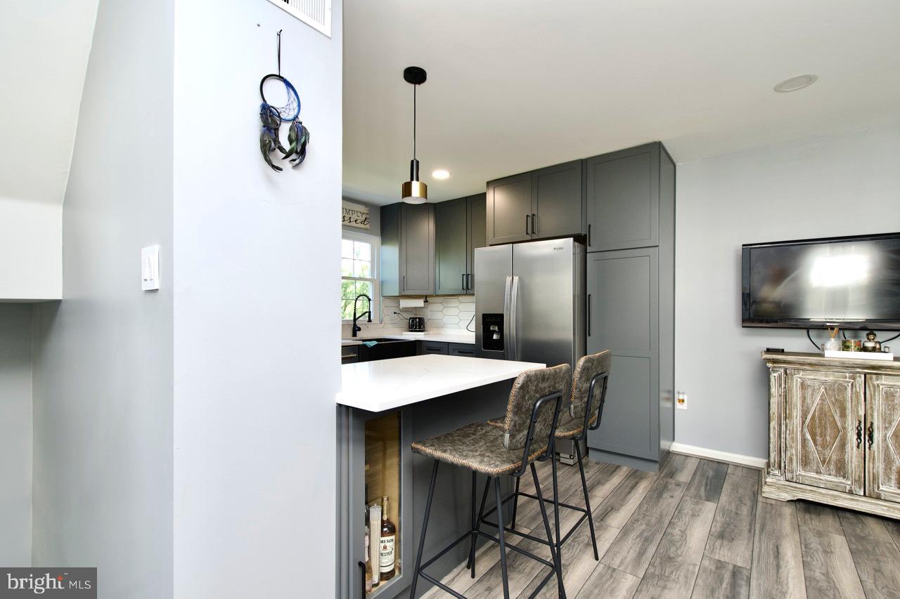 22908 Regent Terrace Sterling, VA 20166 - Photo 15 of 31 a kitchen with stainless steel appliances a refrigerator and microwave