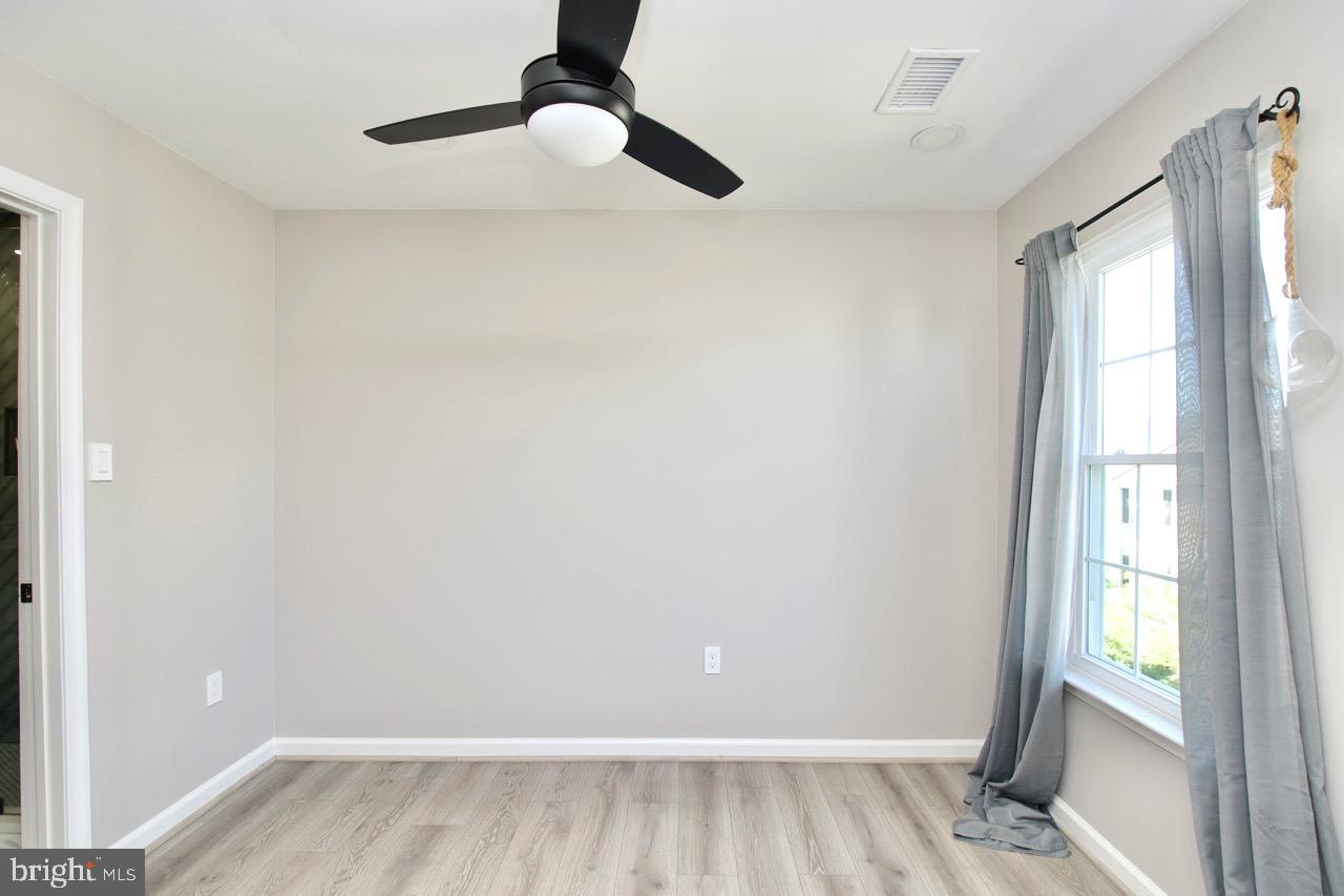 22908 Regent Terrace Sterling, VA 20166 - Photo 16 of 31 a view of an empty room and window