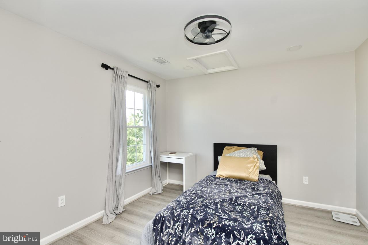 22908 Regent Terrace Sterling, VA 20166 - Photo 21 of 31 a bedroom with a bed and a window