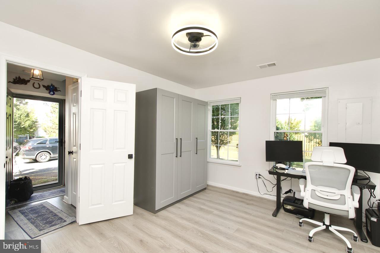 22908 Regent Terrace Sterling, VA 20166 - Photo 24 of 31 a view of a workspace with furniture and a window