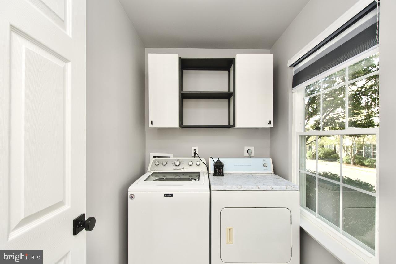 22908 Regent Terrace Sterling, VA 20166 - Photo 28 of 31 a utility room with dryer and washer