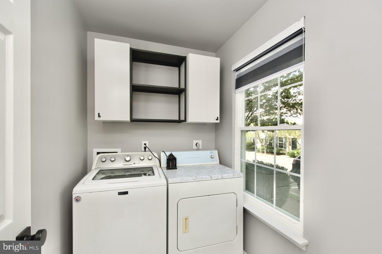 22908 Regent Terrace Sterling, VA 20166 - Photo 29 of 31 a utility room with dryer and washer
