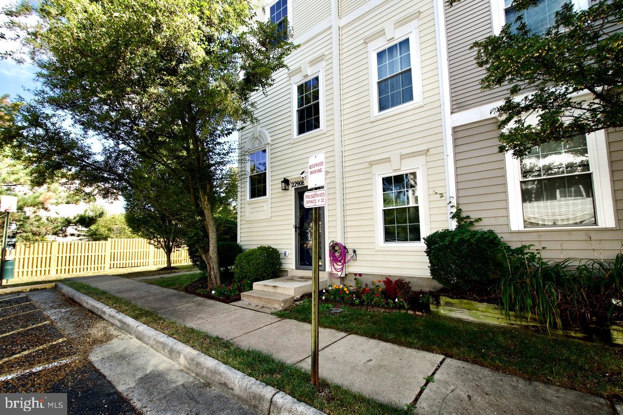 22908 Regent Terrace Sterling, VA 20166 - Photo 30 of 31 a front view of a house with garden