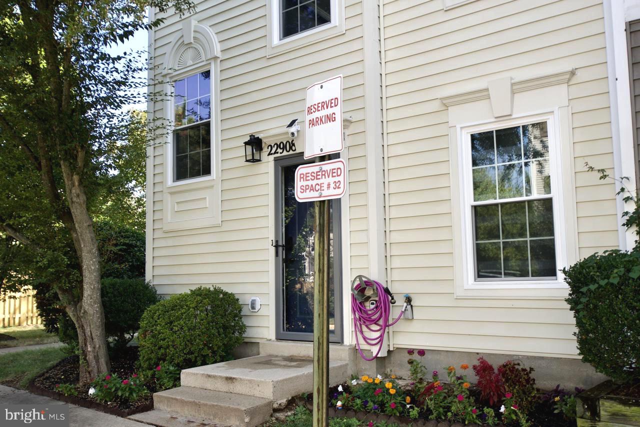22908 Regent Terrace Sterling, VA 20166 - Photo 31 of 31 a view of a house with a yard and potted plants
