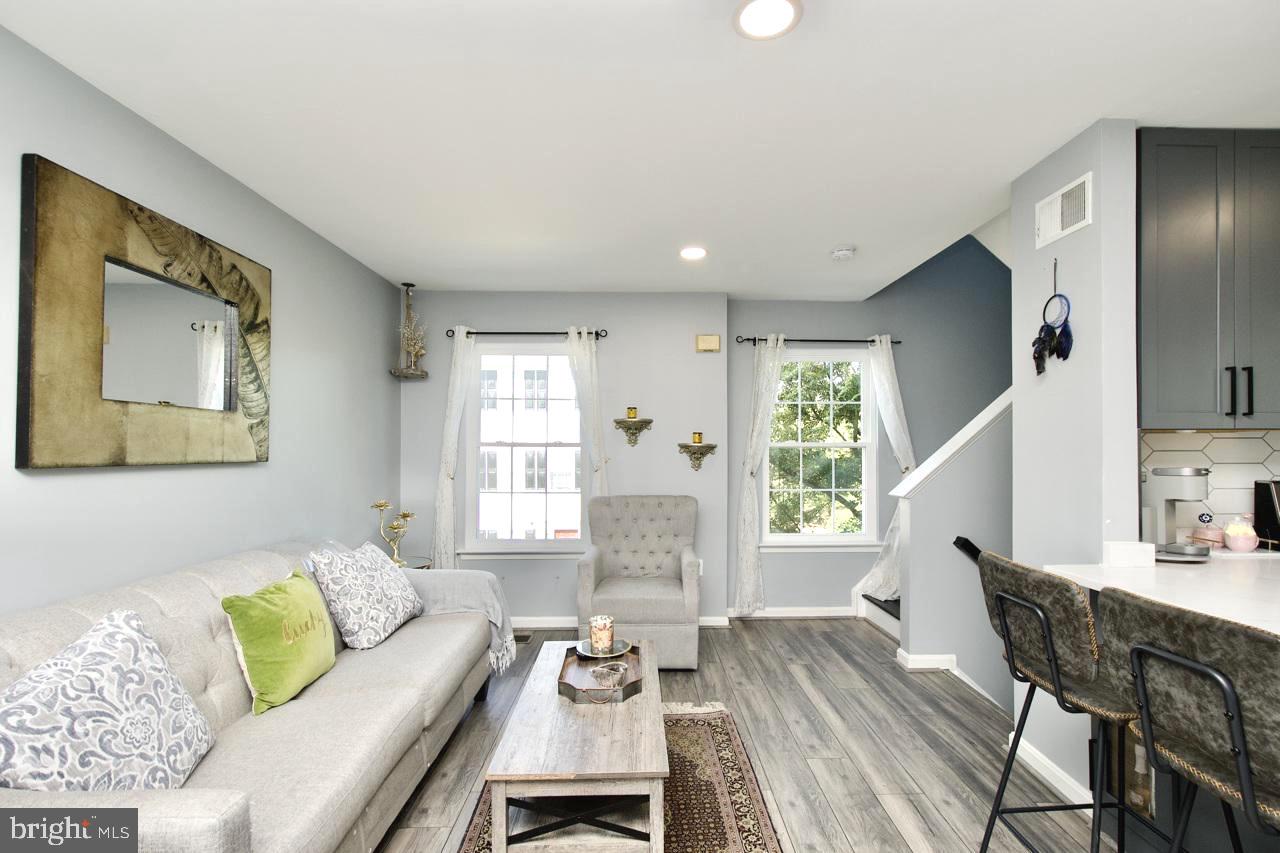 22908 Regent Terrace Sterling, VA 20166 - Photo 4 of 31 a living room with furniture and wooden floor