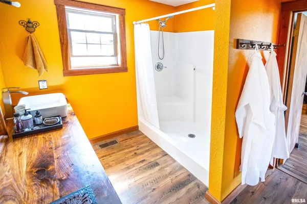 a bathroom with a sink toilet and a mirror