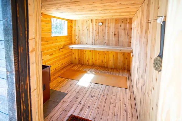 a view of a bench in a grassy field