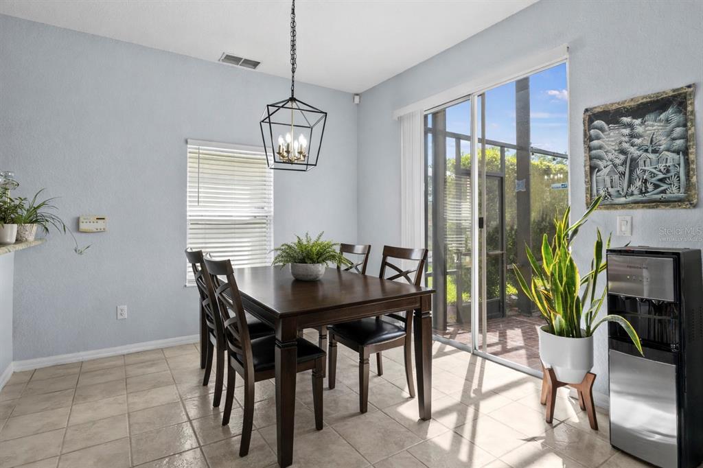 2264 Stone Cross Circle Orlando, FL 32828 - Photo 13 of 45 a view of a dining room with furniture window and outside view