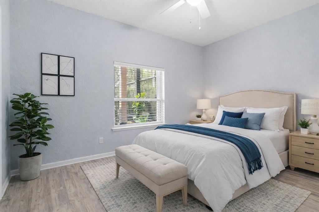 2264 Stone Cross Circle Orlando, FL 32828 - Photo 15 of 45 a bedroom with a bed and a potted plant