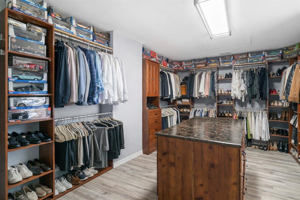 2264 Stone Cross Circle Orlando, FL 32828 - Photo 19 of 45 a view of walk in closet with clothes and shoes