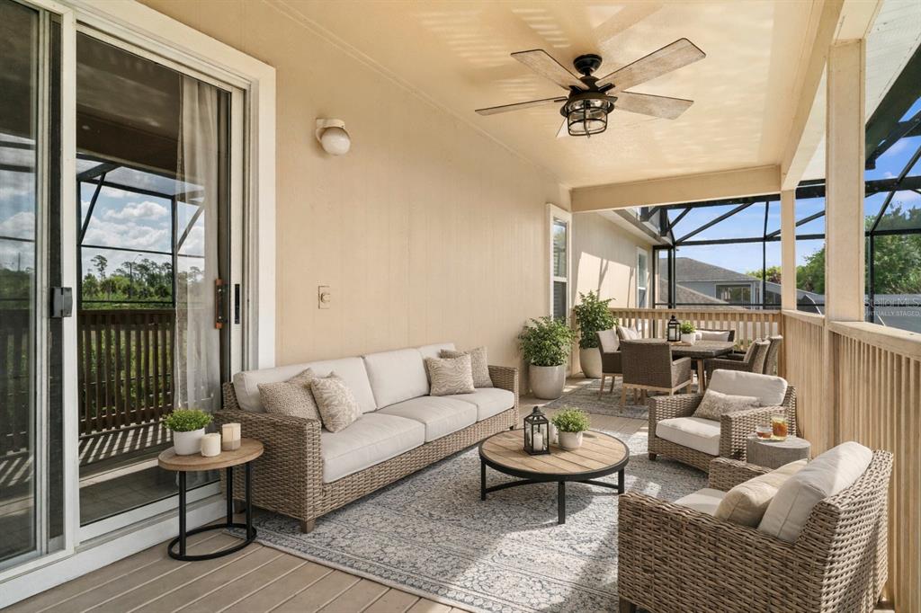 2264 Stone Cross Circle Orlando, FL 32828 - Photo 22 of 45 a living room with furniture a ceiling fan and a window