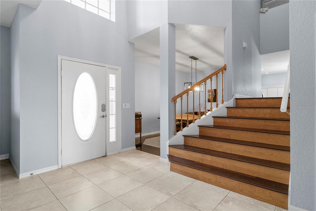 2264 Stone Cross Circle Orlando, FL 32828 - Photo 4 of 45 a view of an entryway with staircase