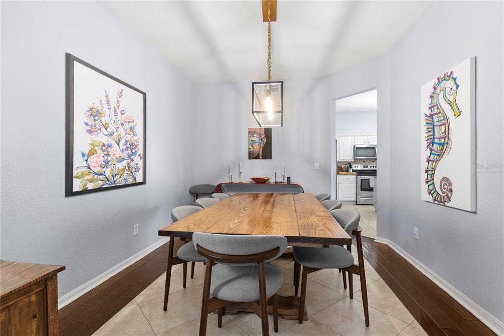 2264 Stone Cross Circle Orlando, FL 32828 - Photo 6 of 45 a dining room with a table and chairs