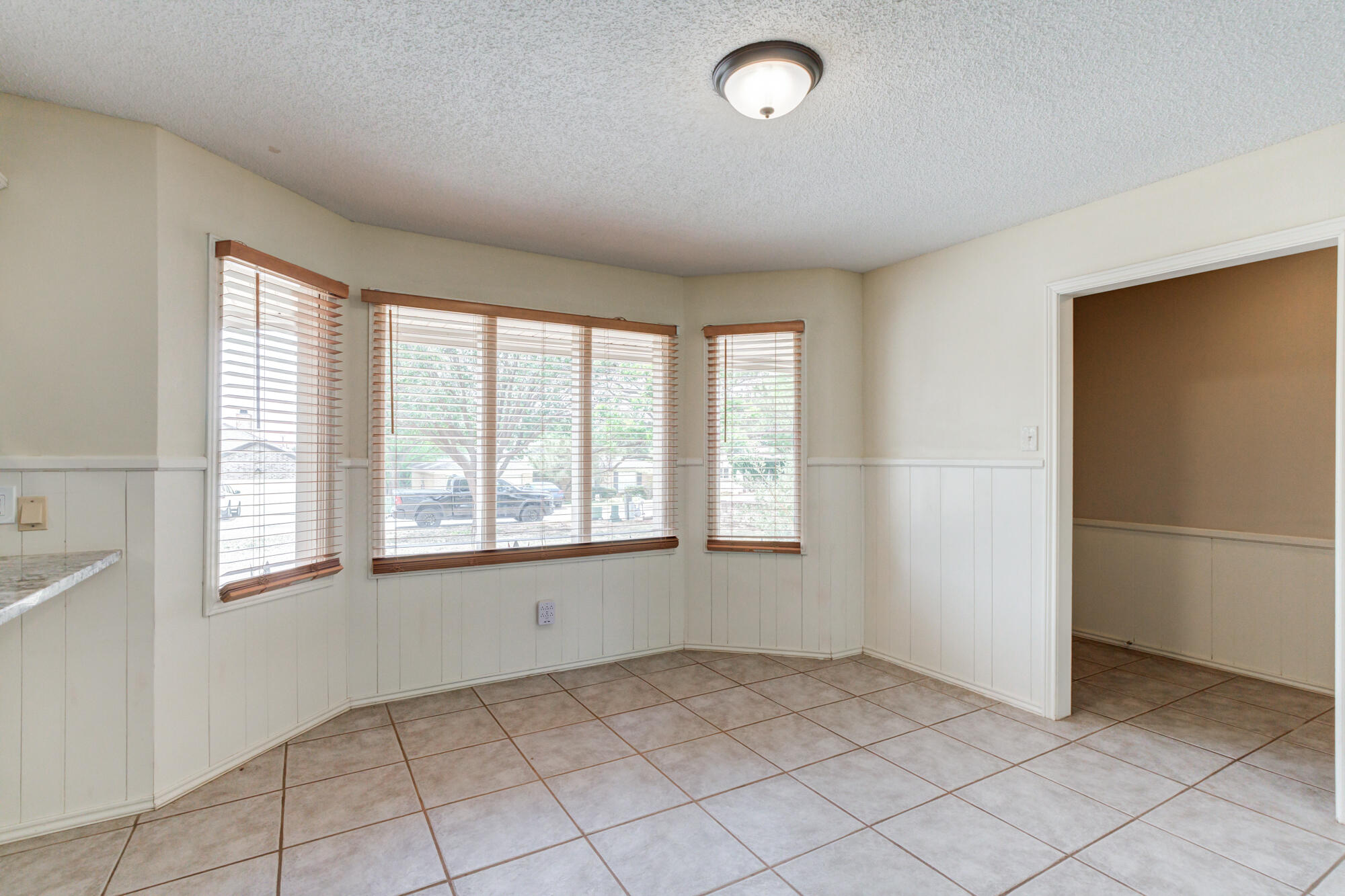 26 Highland Drive Ransom Canyon, TX 79366 - Photo 13 of 53 an empty room with windows