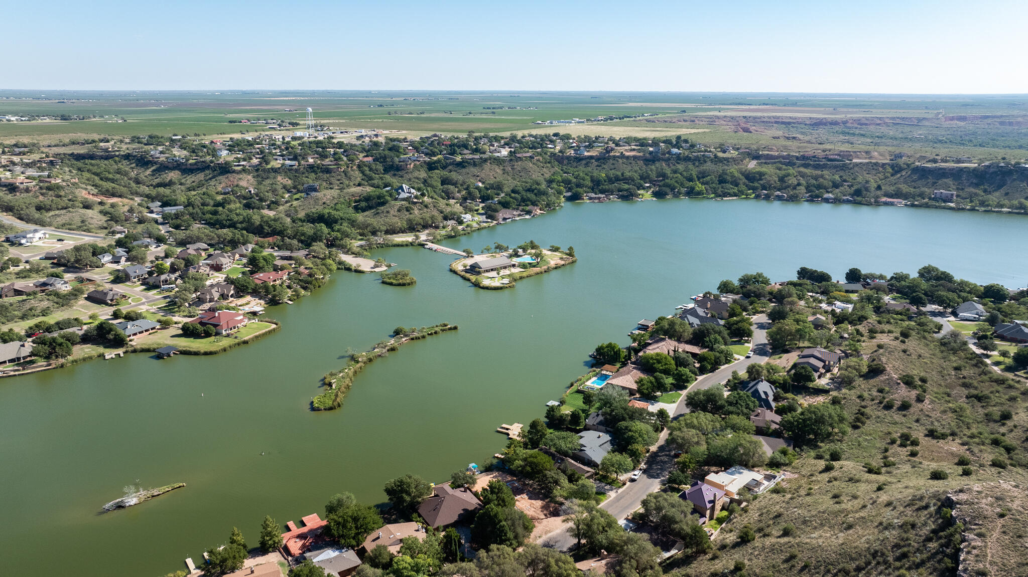 26 Highland Drive Ransom Canyon, TX 79366 - Photo 2 of 53 an aerial view of ocean residential house with outdoor space and trees all around