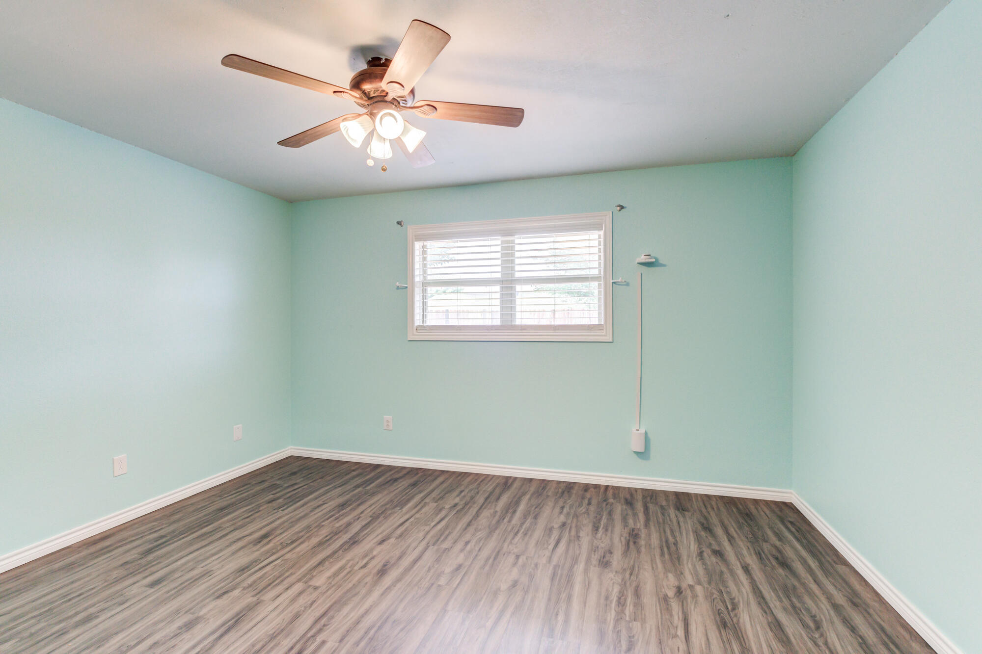 26 Highland Drive Ransom Canyon, TX 79366 - Photo 38 of 53 an empty room with a window and a fan