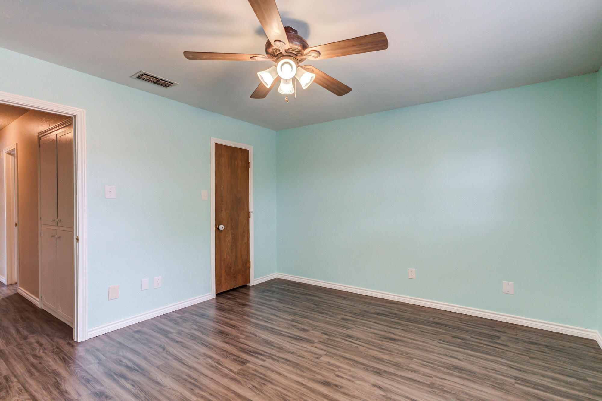 26 Highland Drive Ransom Canyon, TX 79366 - Photo 39 of 53 a view of an empty room with wooden floor