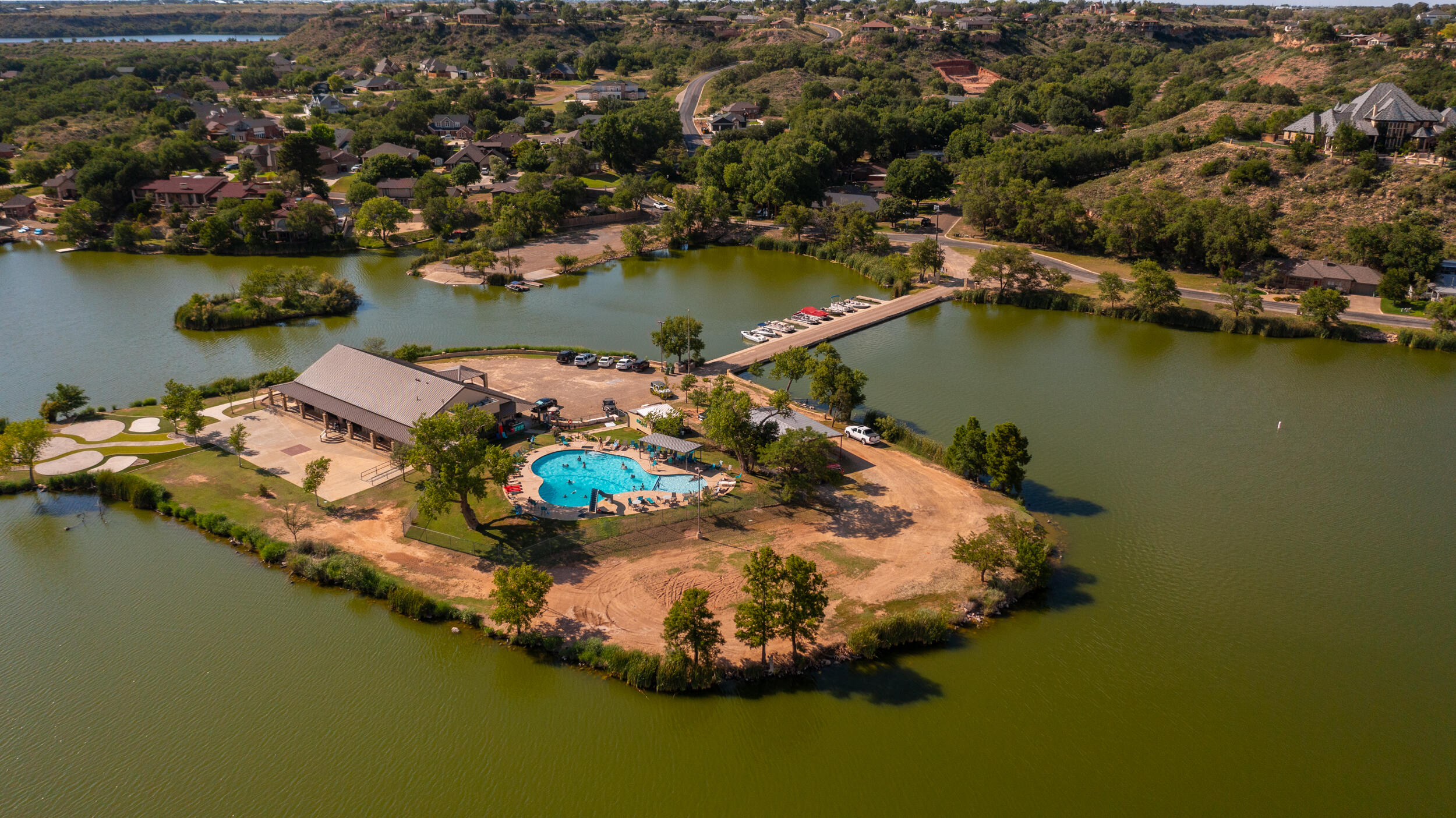 26 Highland Drive Ransom Canyon, TX 79366 - Photo 45 of 53 an aerial view of water body with boats and residential houses with outdoor space