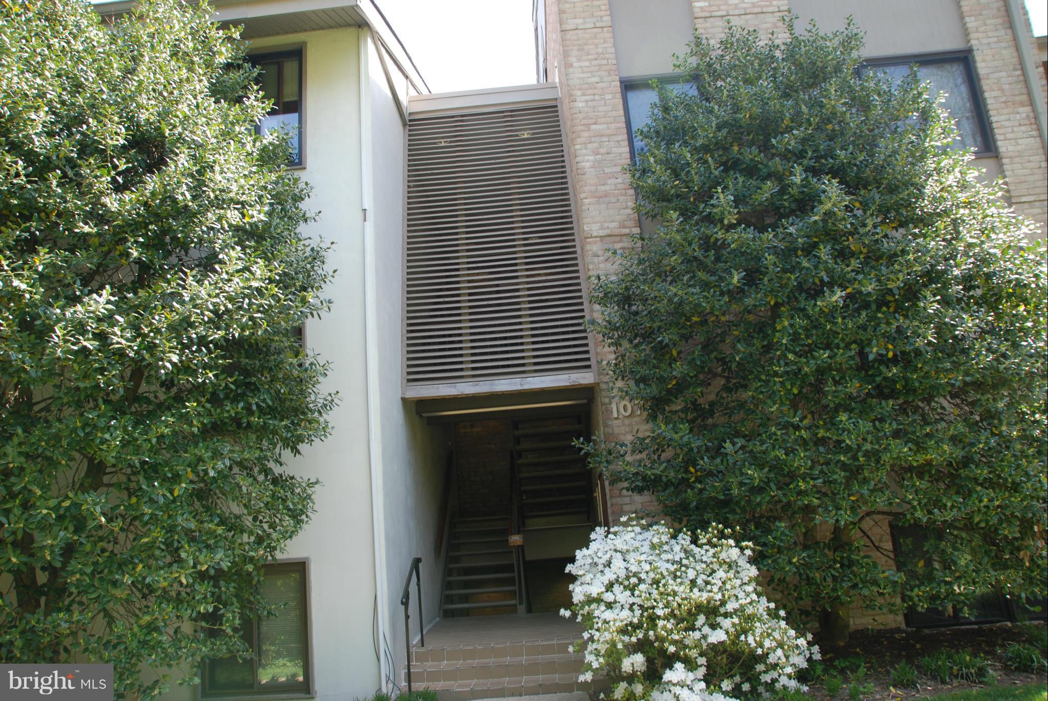 107 Cross Keys Road, Unit R107E Baltimore, MD 21210 - Photo 2 of 14 a view of house with a tree
