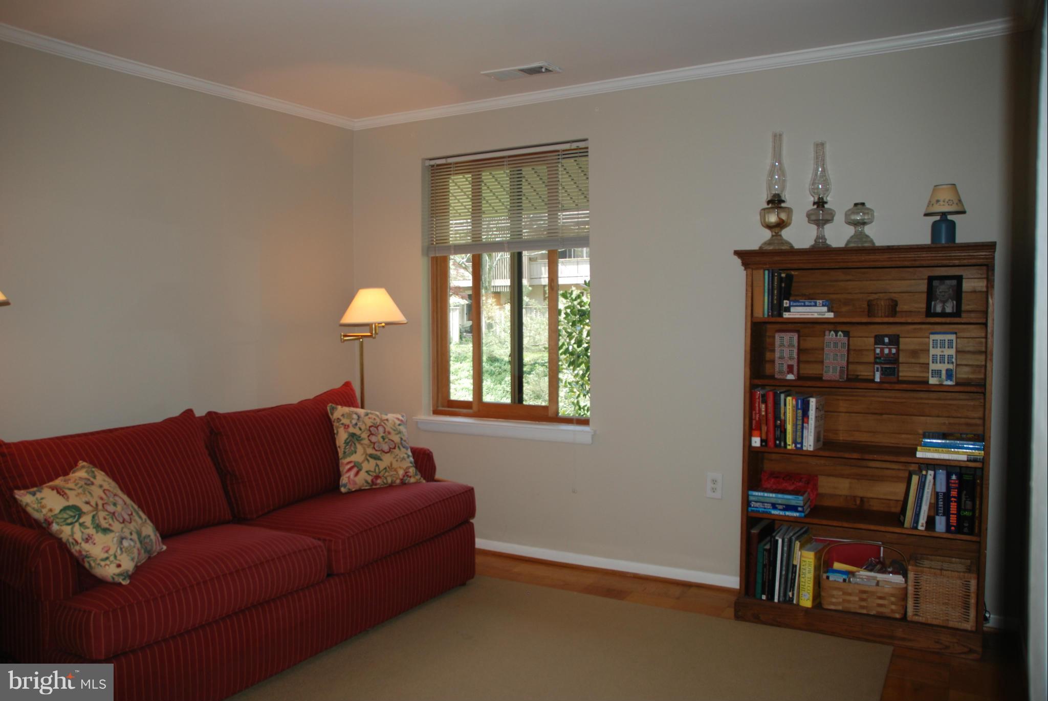 107 Cross Keys Road, Unit R107E Baltimore, MD 21210 - Photo 11 of 14 a living room with furniture and a window
