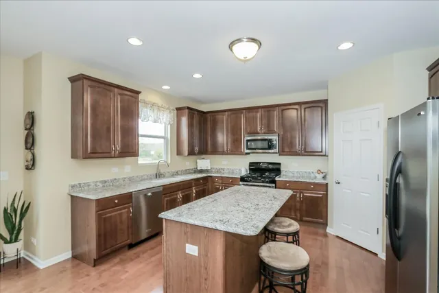 a kitchen with a sink stove and refrigerator