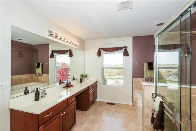 a bathroom with a sink double vanity and a mirror