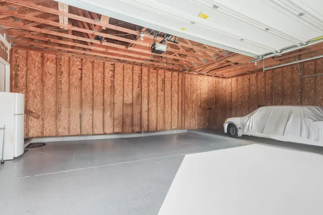 a bedroom with a bed and a table