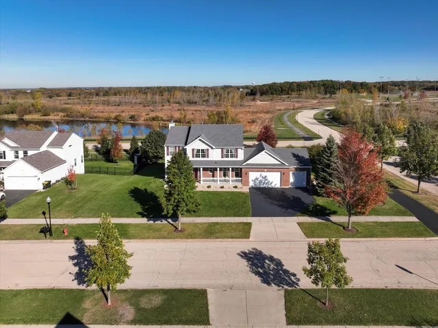 an aerial view of a house with a garden