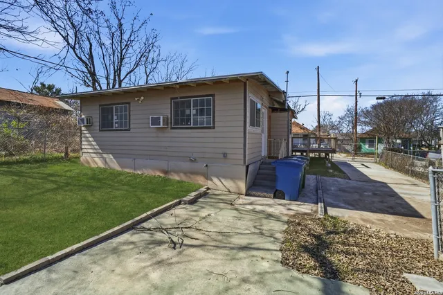 a backyard of a house with lots of green space