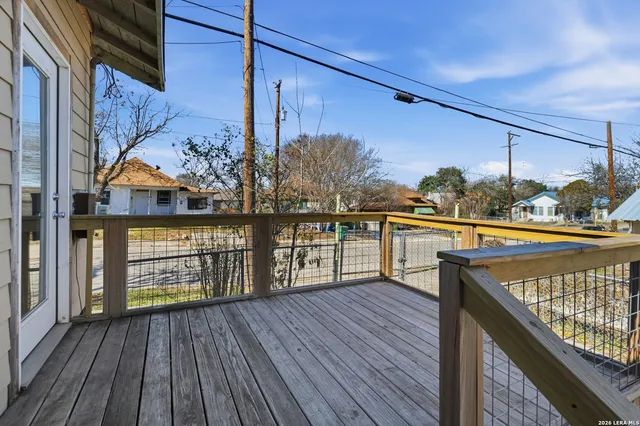 a view of a balcony with wooden floor