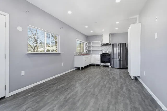 a view of kitchen with stainless steel appliances refrigerator oven
