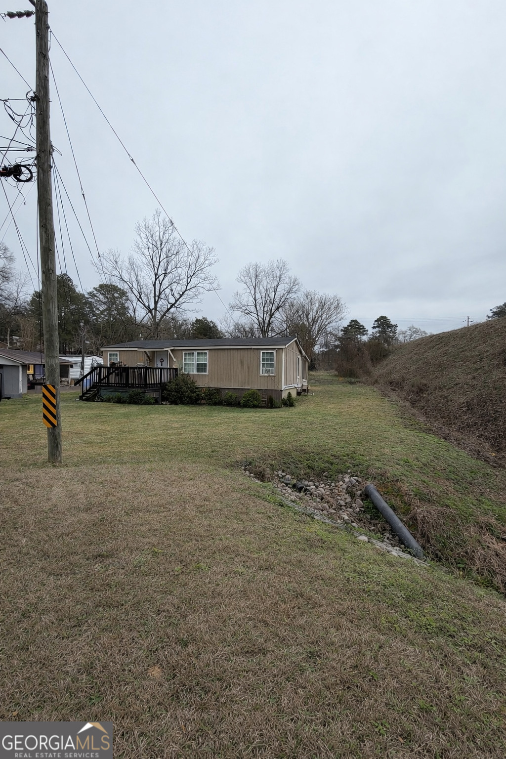 a view of a field with an trees