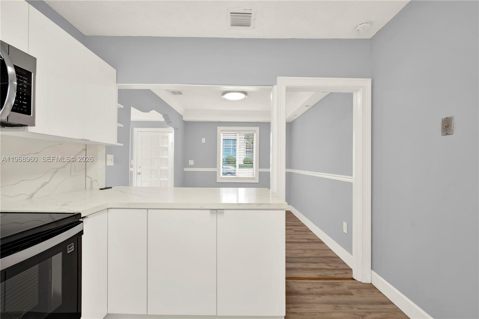 2001 Southwest 37th Avenue Miami, FL 33145 - Photo 12 of 31 a kitchen with cabinets and a stove