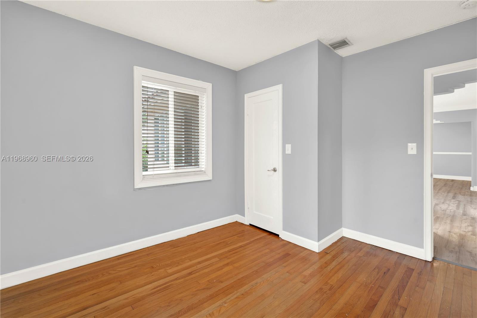 2001 Southwest 37th Avenue Miami, FL 33145 - Photo 21 of 31 a view of a room with wooden floor and windows