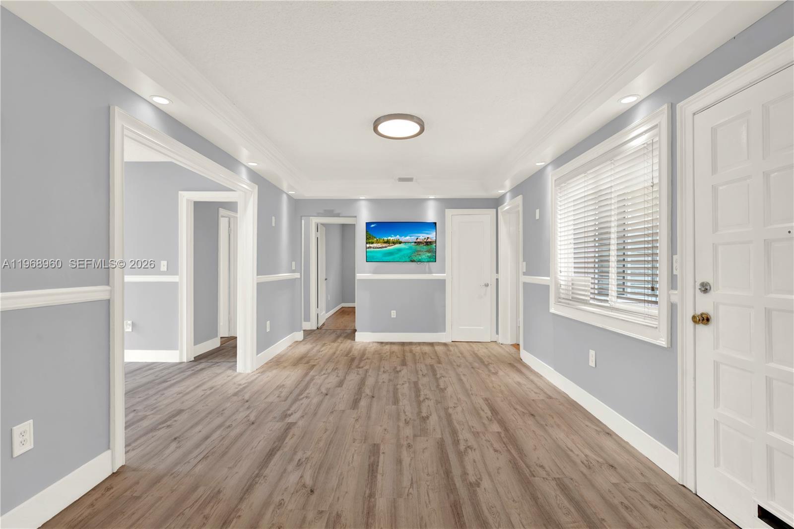 2001 Southwest 37th Avenue Miami, FL 33145 - Photo 6 of 31 a view of a room with wooden floor and window