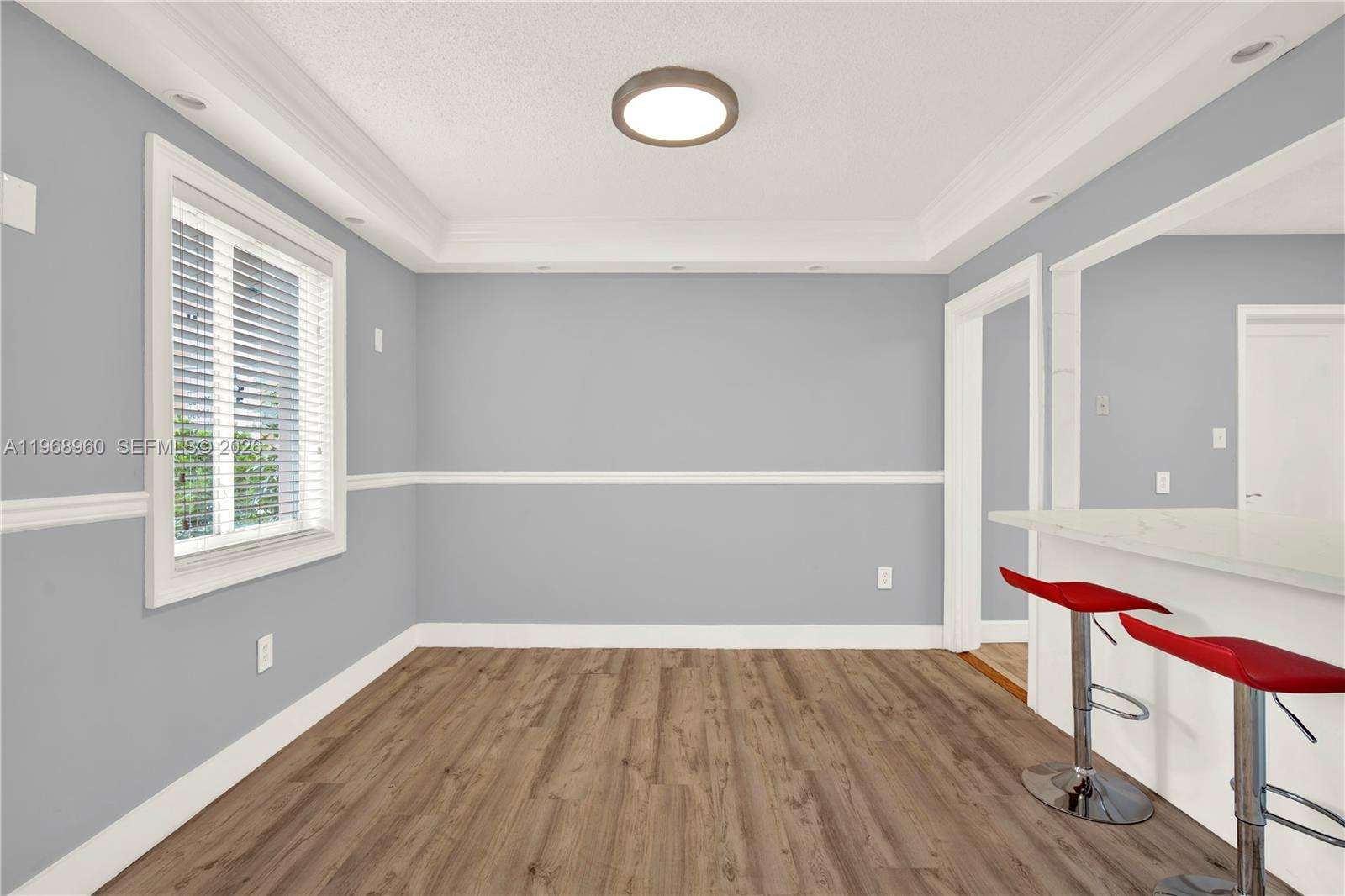2001 Southwest 37th Avenue Miami, FL 33145 - Photo 7 of 31 an empty room with wooden floor and windows
