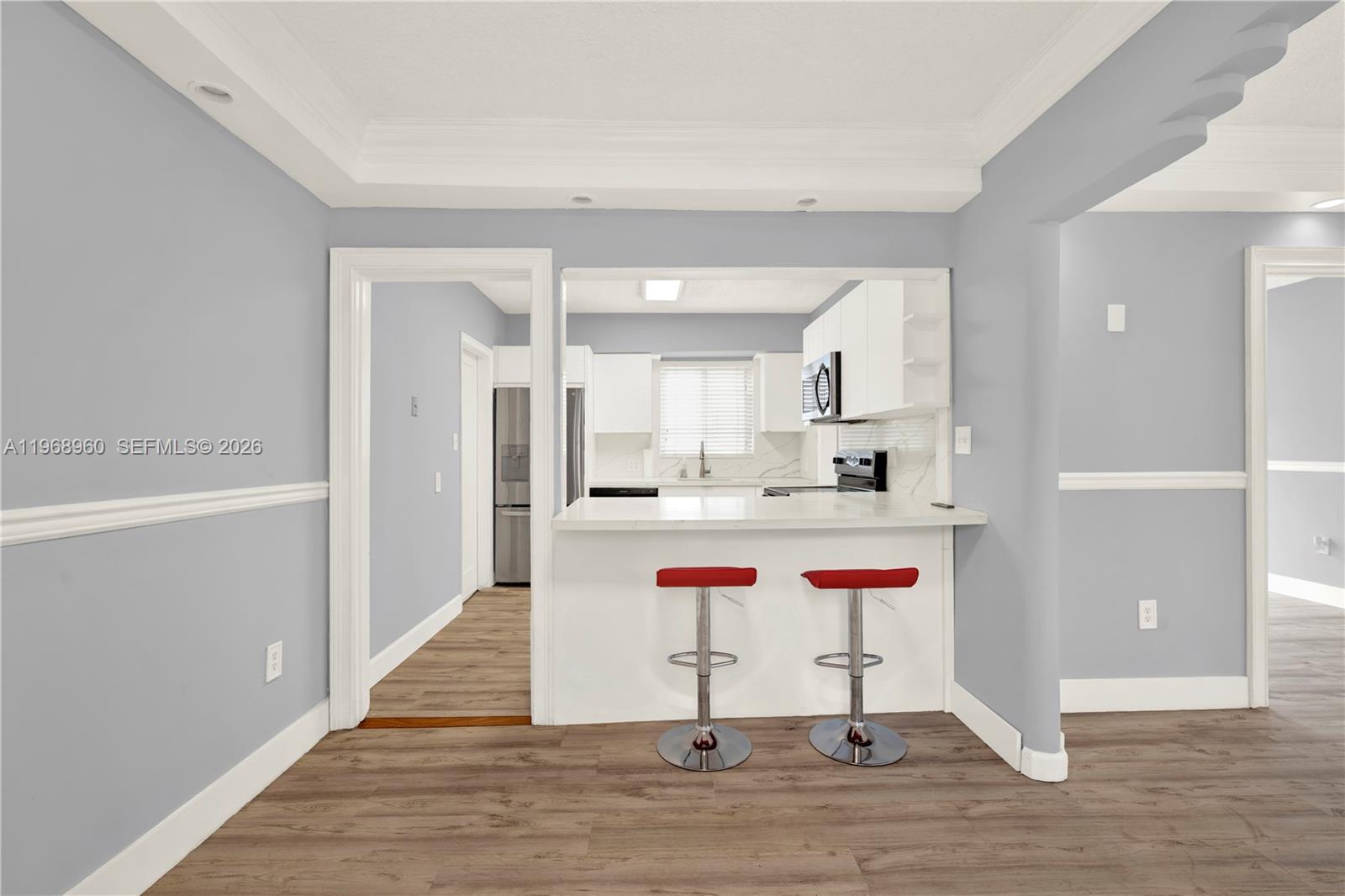 2001 Southwest 37th Avenue Miami, FL 33145 - Photo 8 of 31 a dining area with a table and chairs