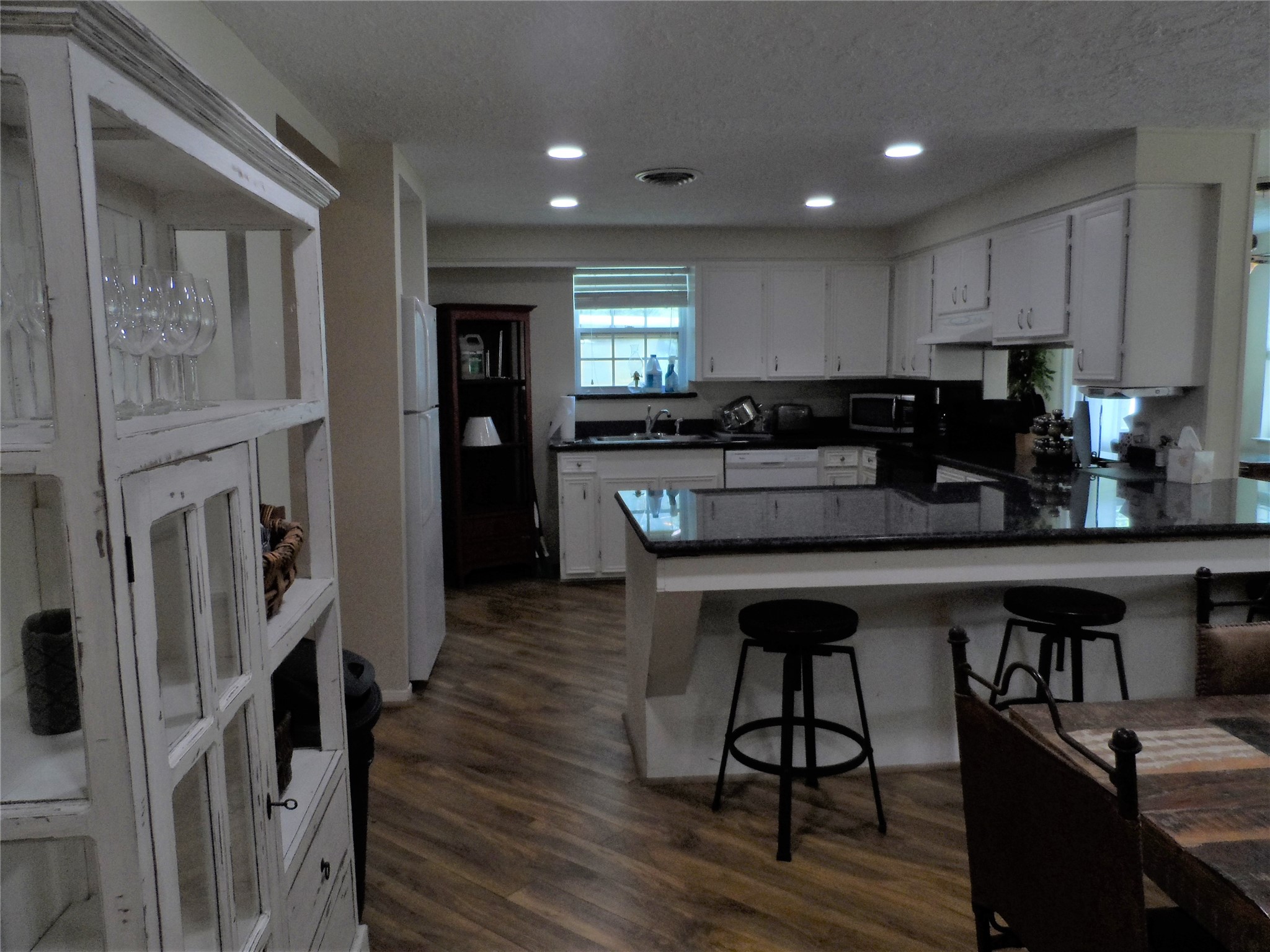 13545 Northshore Loop Conroe, TX 77304 - Photo 14 of 44 a kitchen with stainless steel appliances granite countertop a stove refrigerator and cabinets