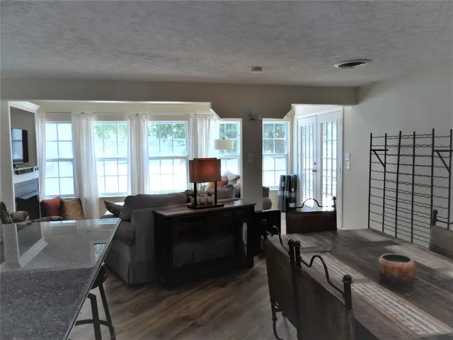a dining room with furniture and window