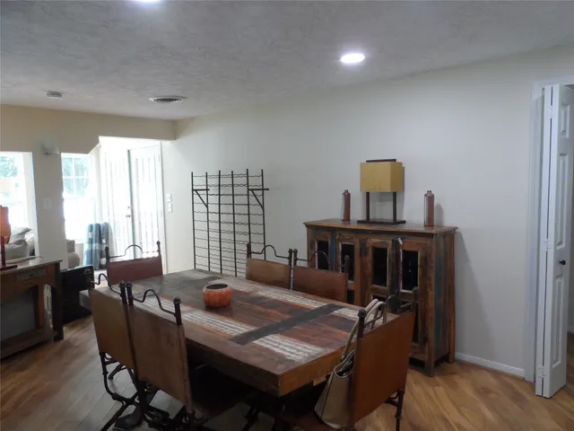 a view of a livingroom with furniture and windows