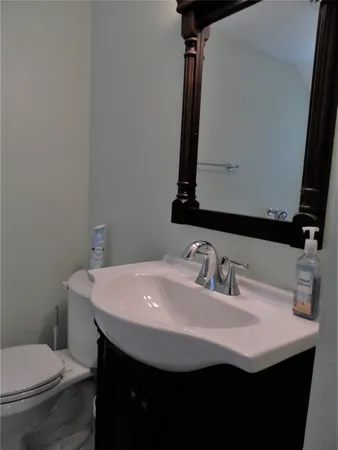 a bathroom with a sink and mirror