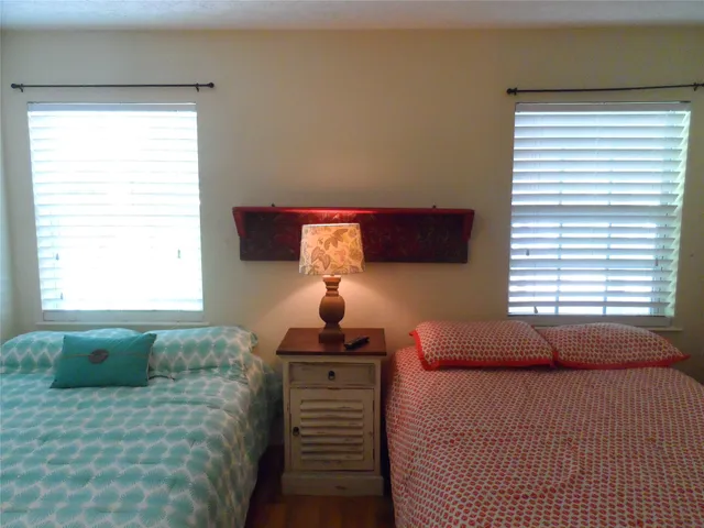 a bedroom with a bed and a mirror