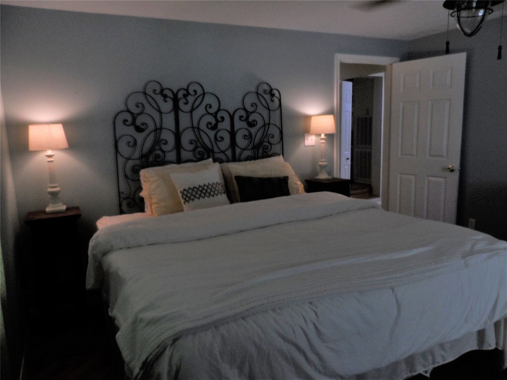 13545 Northshore Loop Conroe, TX 77304 - Photo 35 of 44 a bedroom with a bed and night stand