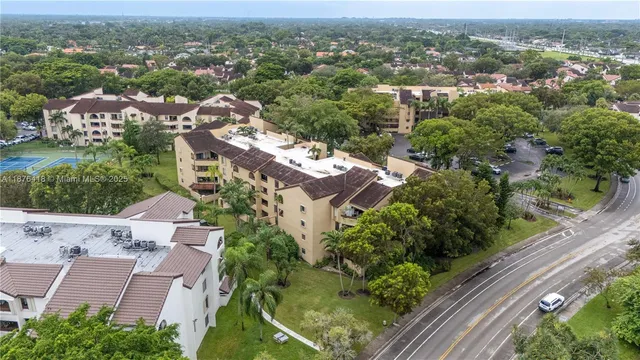 an aerial view of residential houses with outdoor space
